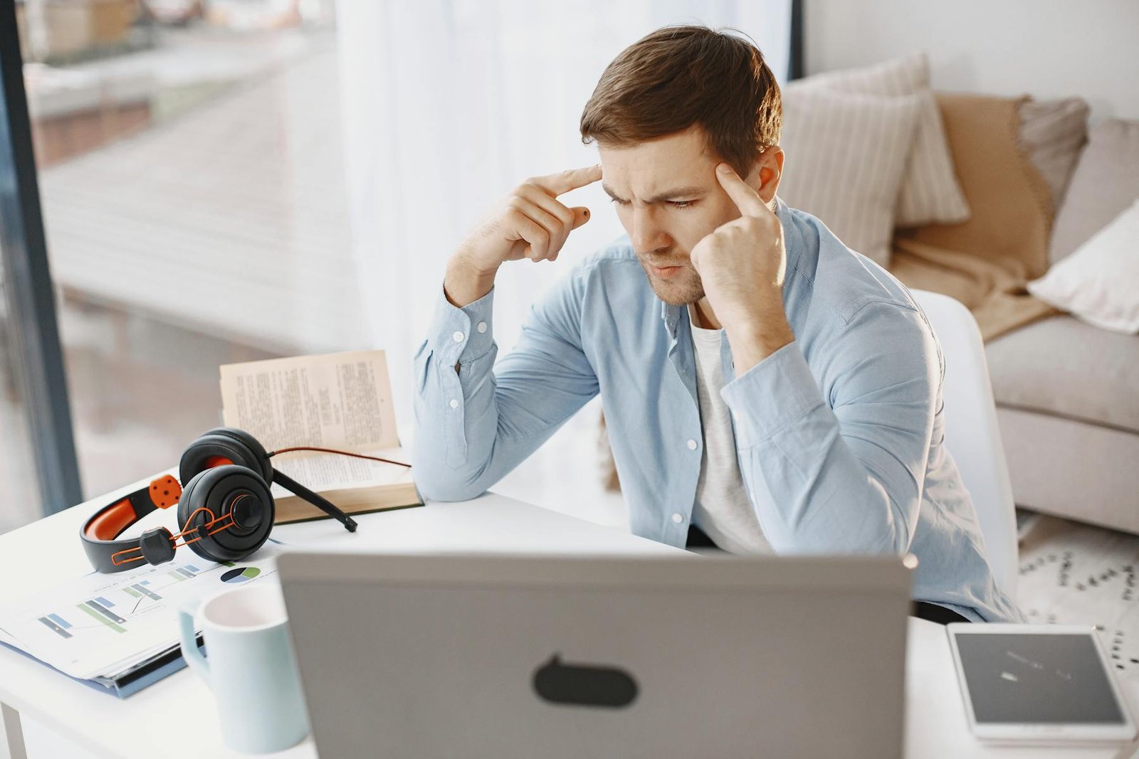 A person working with focus at a laptop